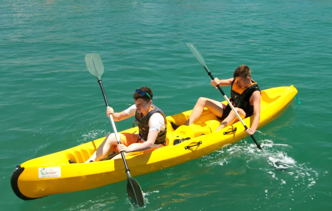Two guests in a yellow kayak